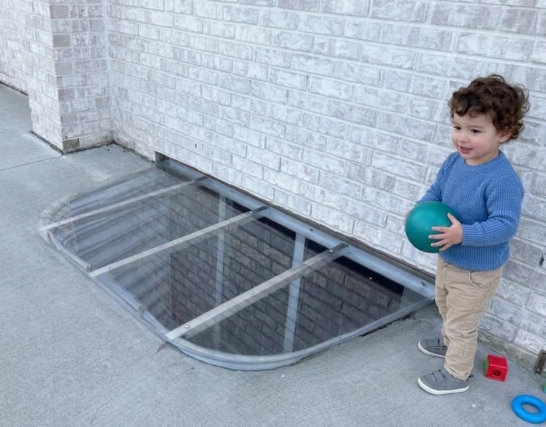 Custom window well cover installed at Castle Rock home helping protect children from open window wells